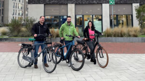 3 employees with bicycles